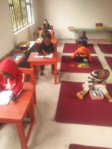 students on mats inside classroom