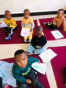 students on mats inside classroom