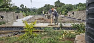 Image of a construction site with main working on foundation